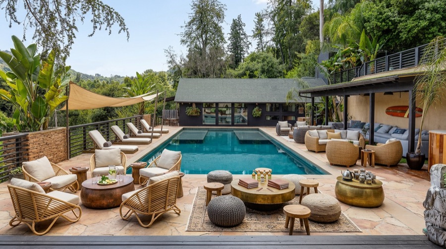 Pool area arranged with custom furniture and styling